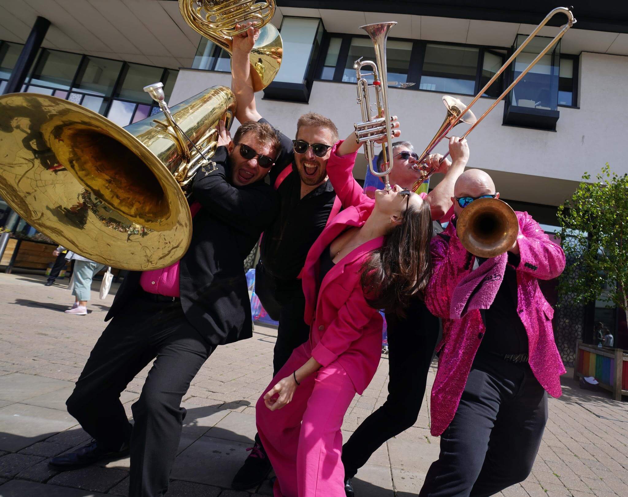 Oompah Brass performing with a bride at a wedding